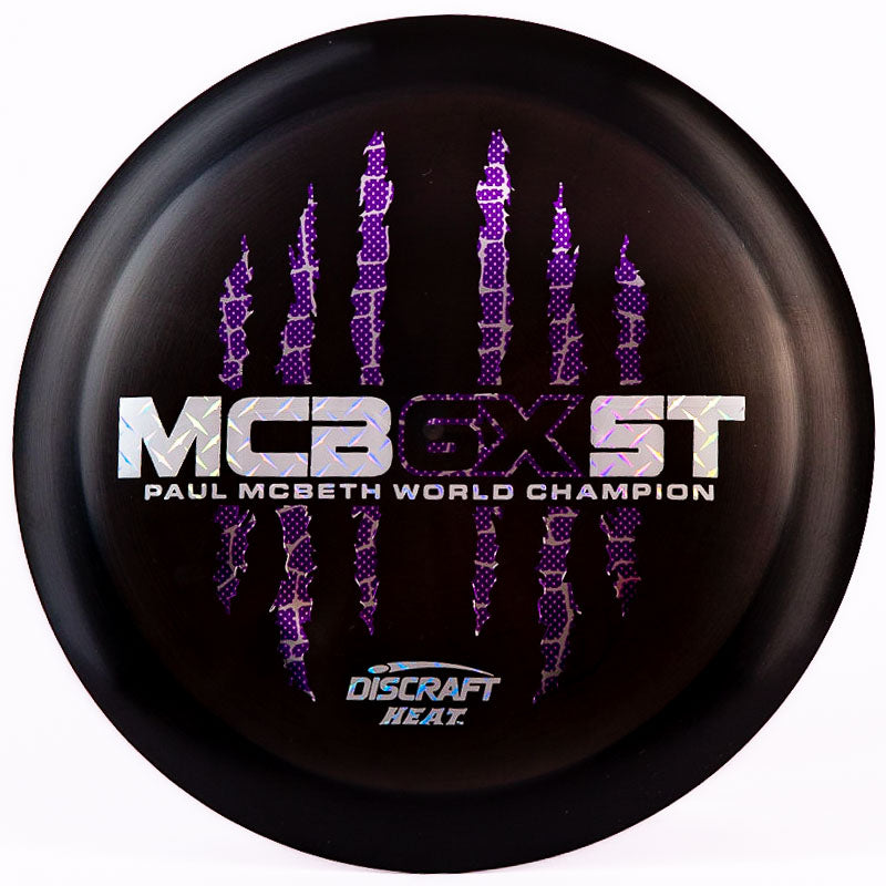 A black Discraft Heat with a purple and silver stamp